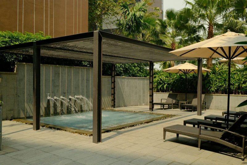 Photo by Long Chung Outdoor spa area with lounge chairs and umbrellas