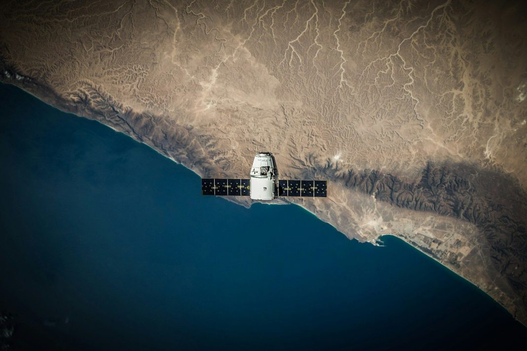 Photo by SpaceX A space satellite hovering above the coastline