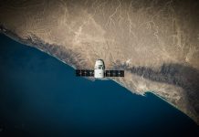 How to Track Satellite Images A space satellite hovering above the coastline