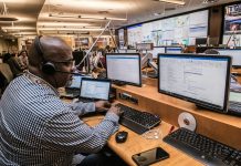 How Forward-Thinking Manufacturers Are Eliminating Costly Unplanned Downtime man in black and white checkered dress shirt using computer