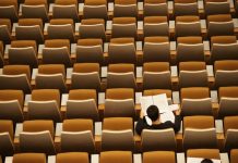From Language Skills to Logical Reasoning: The Wider Scope of ICSE person reading in empty lecture hall