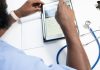 When AI Writes Your Medical Record: What Patients Need to Know a man using a tablet