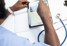 When AI Writes Your Medical Record: What Patients Need to Know a man using a tablet