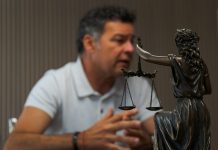 The 72-Hour Window That Decides What a Serious Injury Claim Is Worth A man sitting at a table in front of a statue