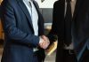 Clean Books, Faster Close: Why 2026 Buyers Walk From Messy Deals Two business partners shaking hands in agreement