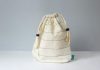 a white bag sitting on top of a white table