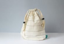 Lightweight Versatility: Why Custom Drawstring Bags Win with Students and Athletes a white bag sitting on top of a white table