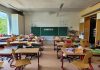 A classroom filled with lots of desks and chairs