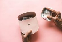 Why Stress Triggers Comfort Spending brown leather hand bag on pink table