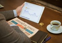 Navigating Debt, Hybrid, and Equity Mutual Funds: A Portfolio Guide for MF App Users a person sitting at a table with a tablet and a cup of coffee