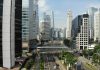 Essential Financial and Legal Considerations for Expanding a Business into Indonesia High-angle view of a multi-lane road with traffic and a pedestrian bridge in Jakarta