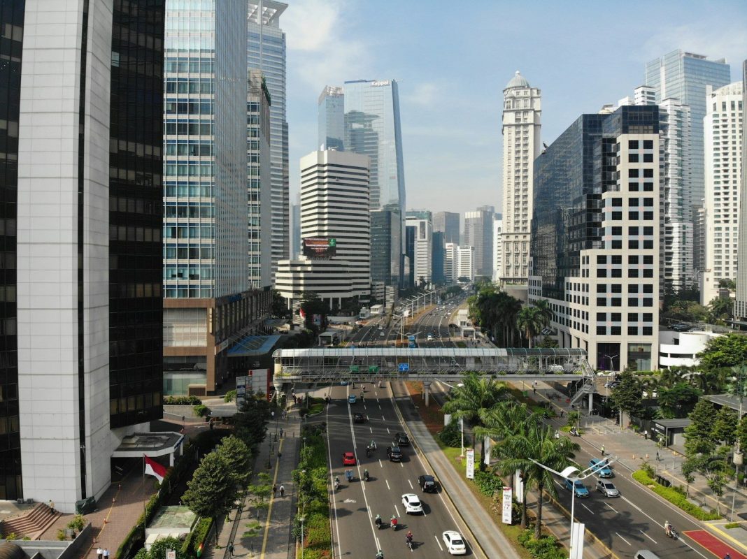 Photo by Afif Ramdhasuma High-angle view of a multi-lane road with traffic and a pedestrian bridge in Jakarta