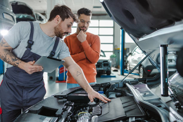 2200-electric-car-repair-shop-stock-photos-and-r
